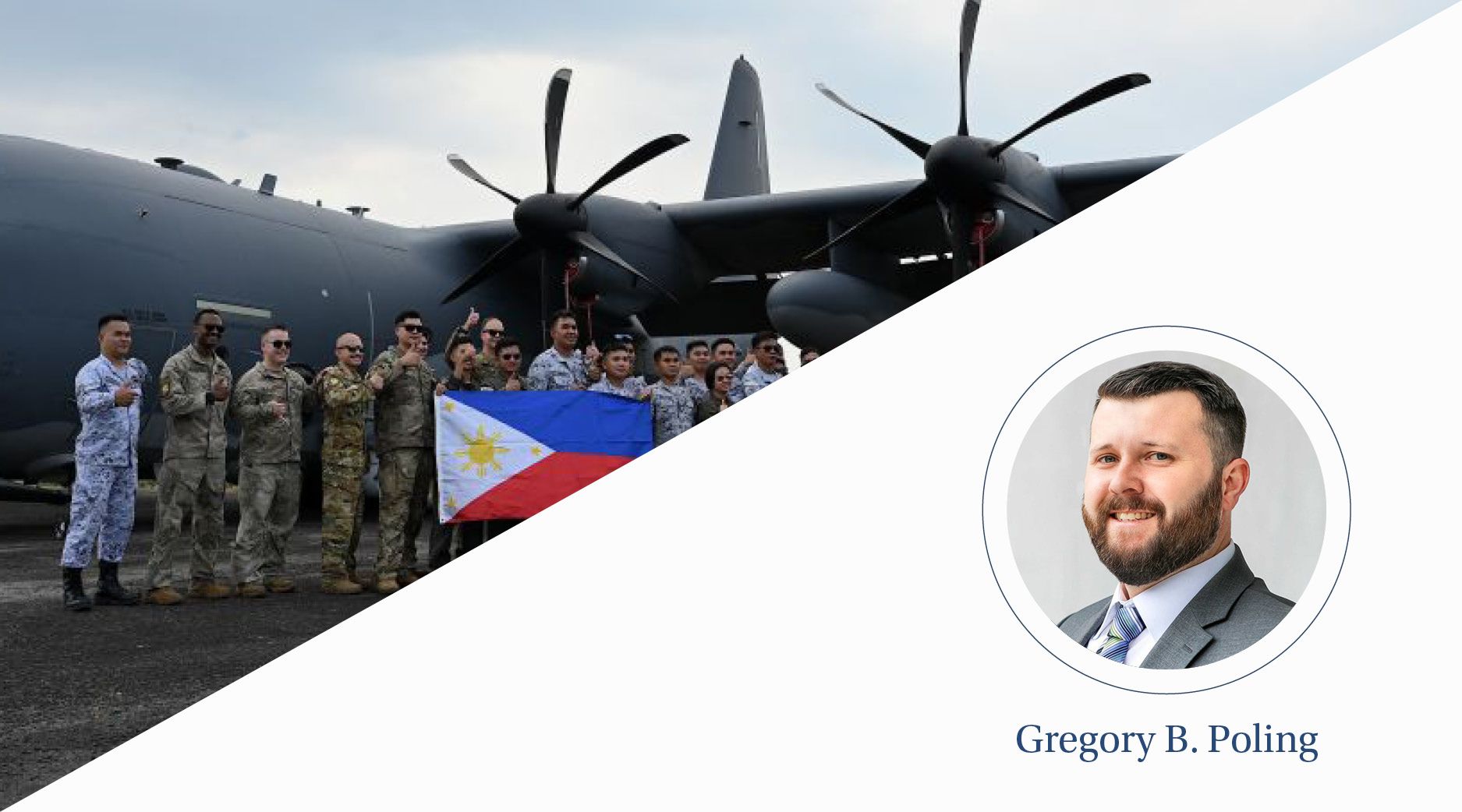Servicemen hold the national flag of the Philippines in front of an aircraft.
