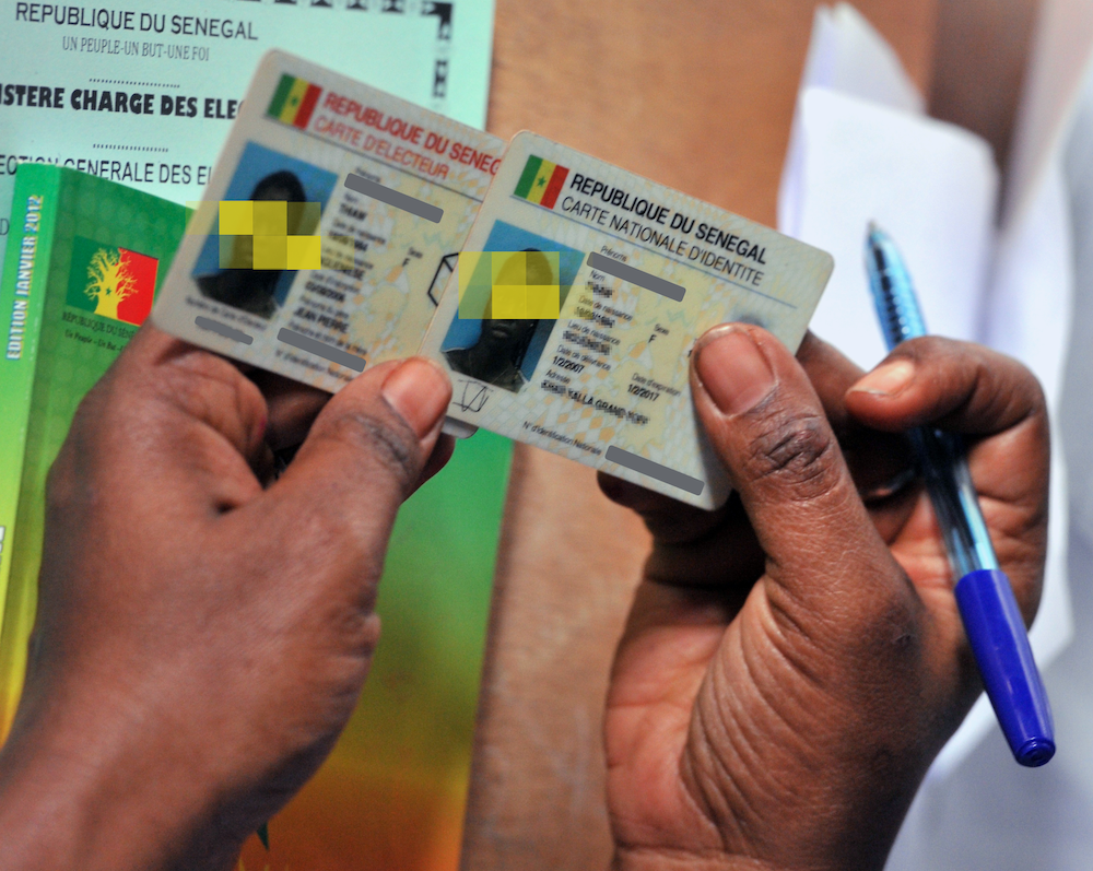 A Senegalese resident's voting card and identity card. | Issouf Sanogo/AFP via Getty Images