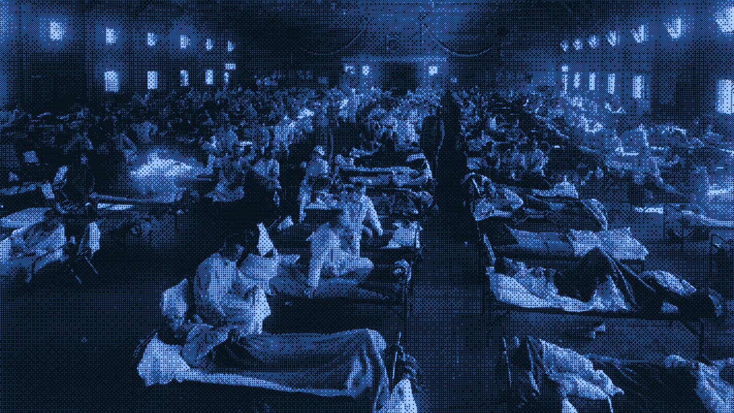 Patients infected with H1N1 recuperate in an emergency hospital in Camp Funston, Kansas, in the midst of the 1918 pandemic. | National Museum of Health and Medicine via Picryl