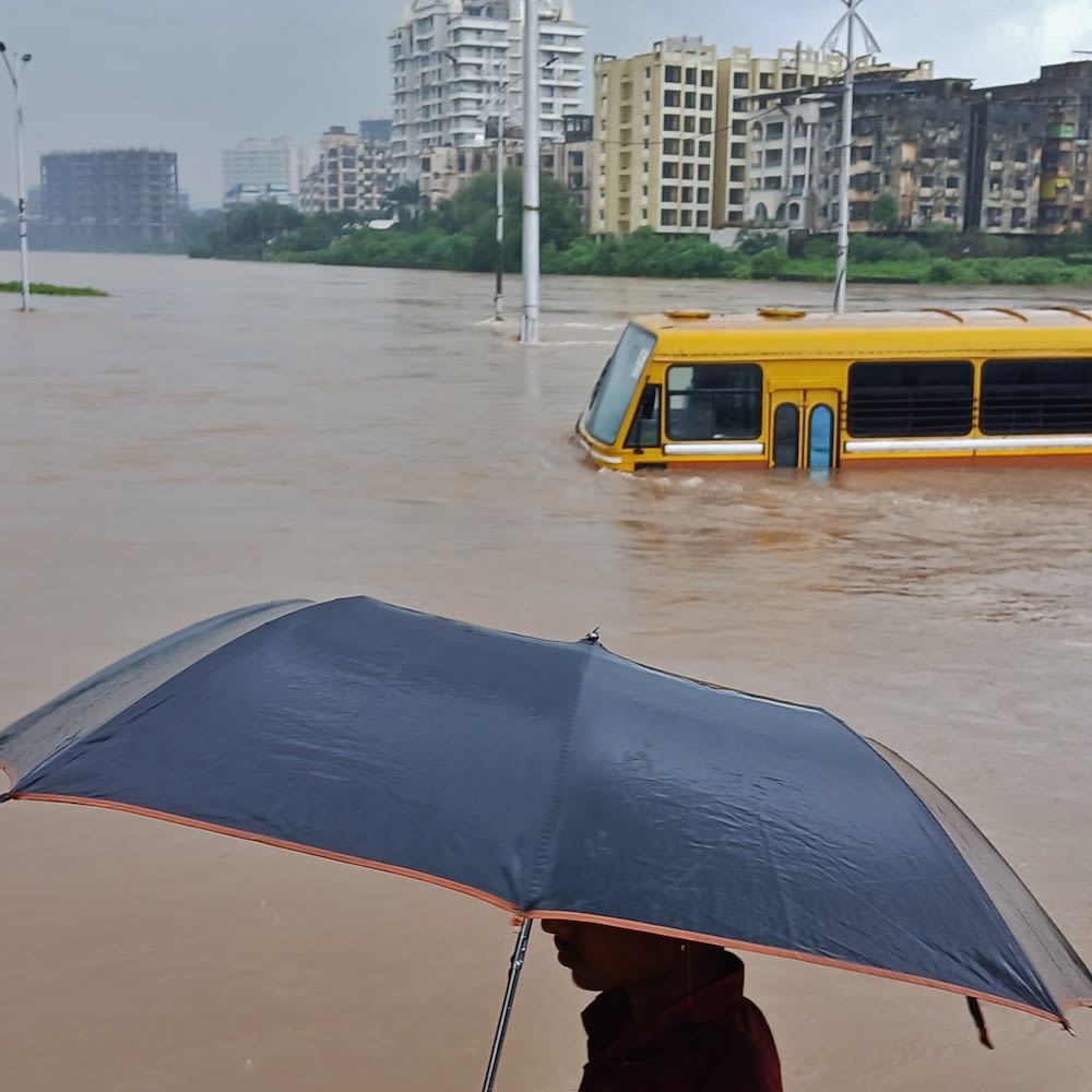People navigate a flood.