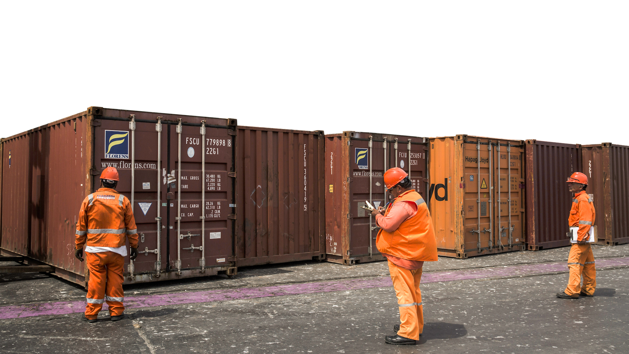Longshoremen preparing shipping containers filled with copper plates at the Port Terminal of Ilo, Peru.