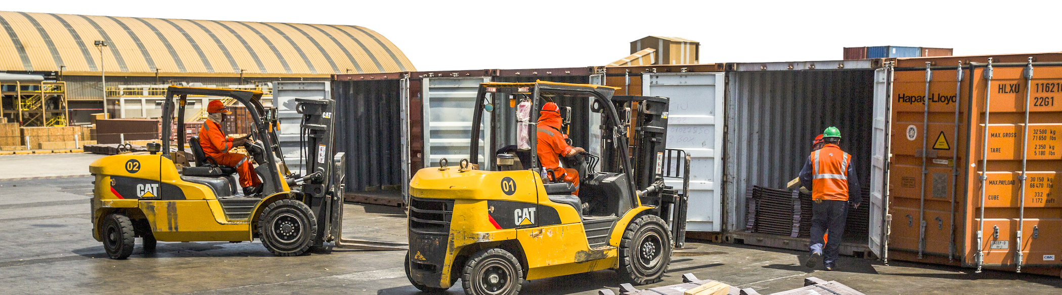 Longshoremen use Caterpillar Inc. forklifts to fill shipping containers with copper plates at the Port Terminal of Ilo, Peru.