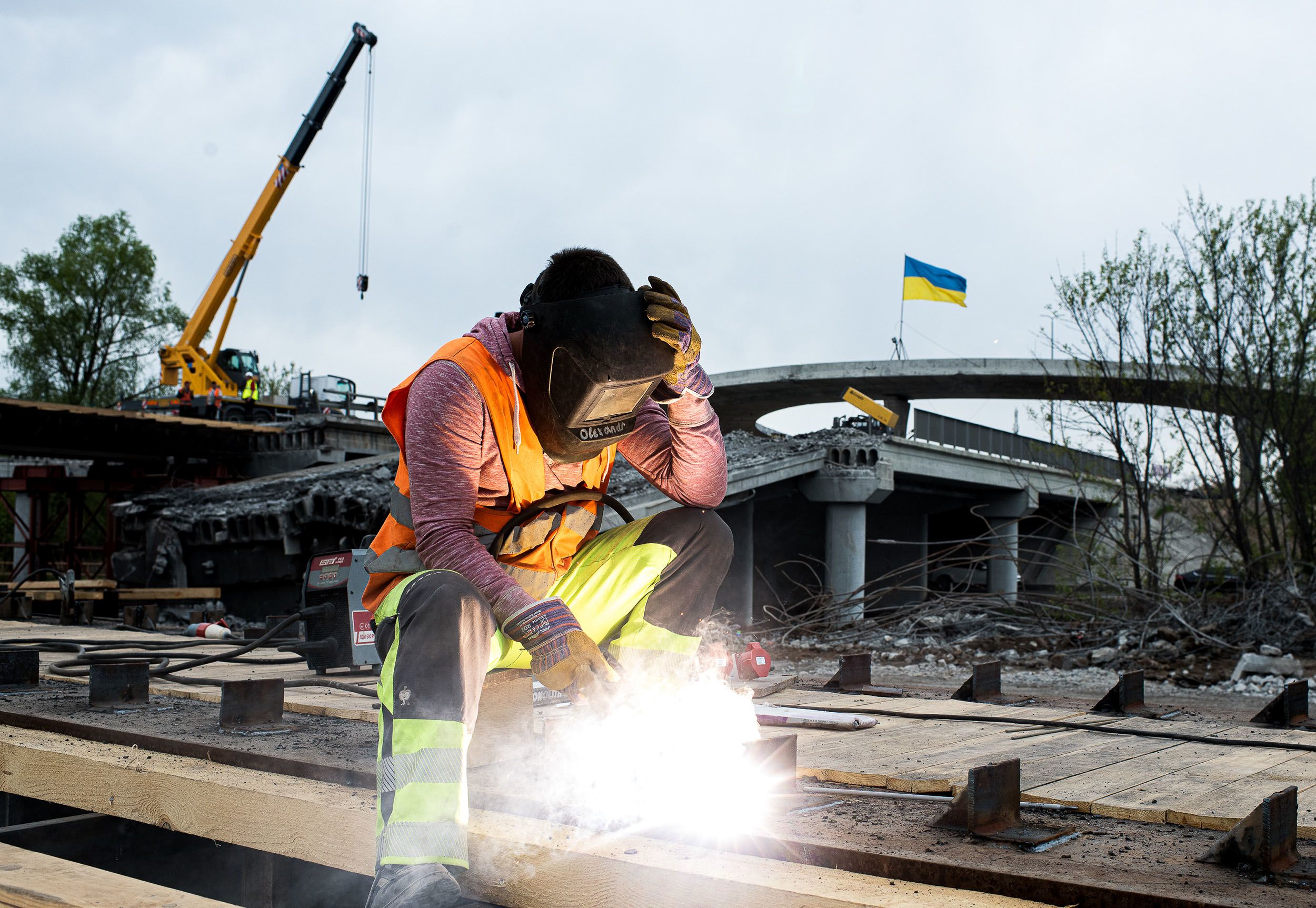 A welder working on a new bridge in Ukraine