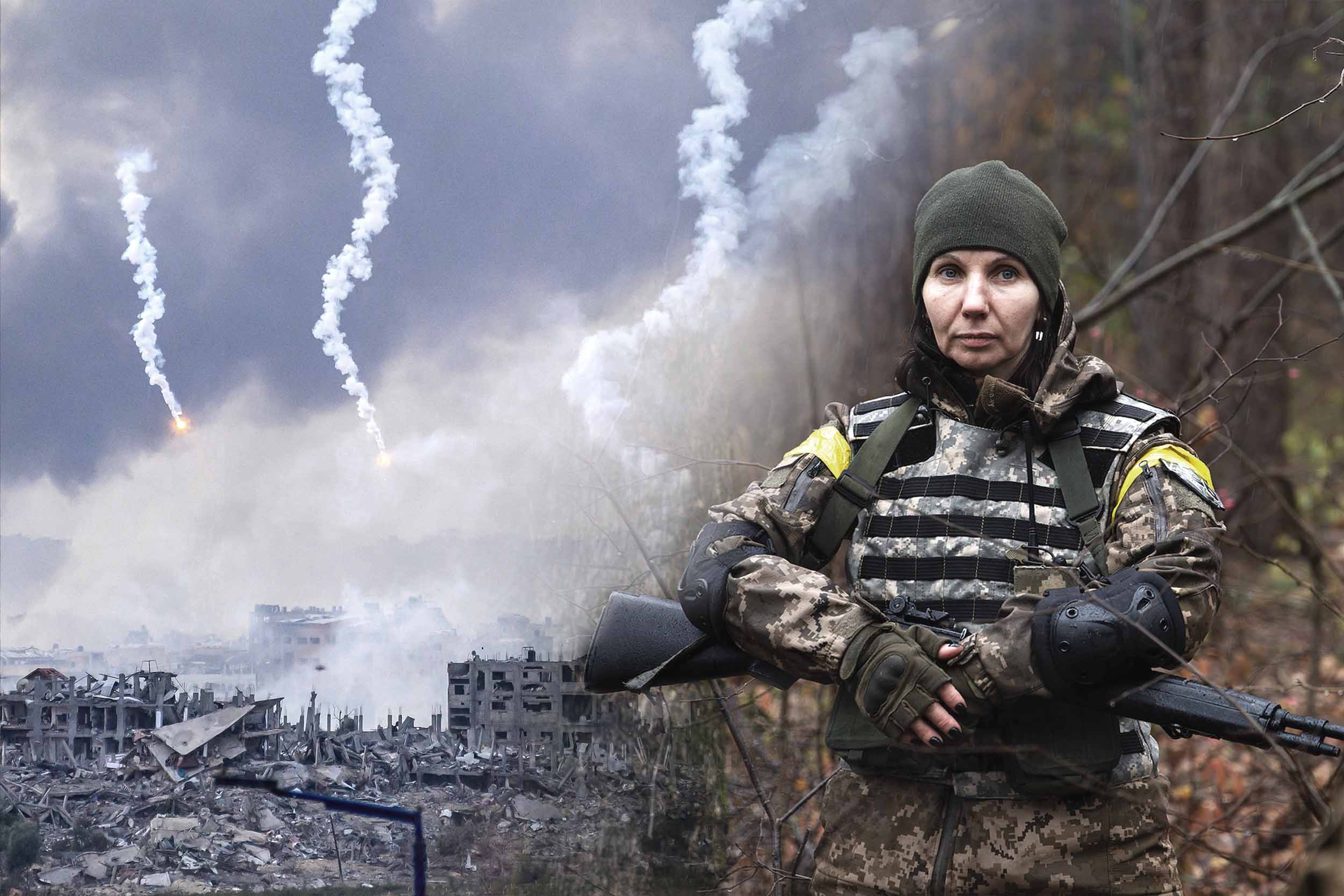 A Ukrainian soldier stands in the foregound, while smoke over Gaza is seen in the background