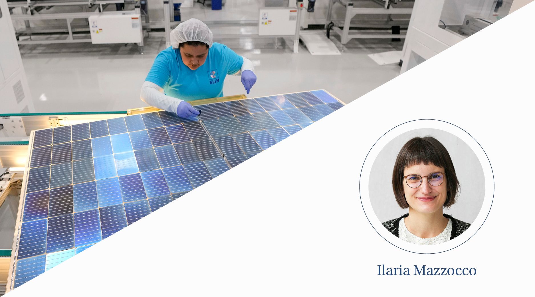 A woman works on a blue solar panel.