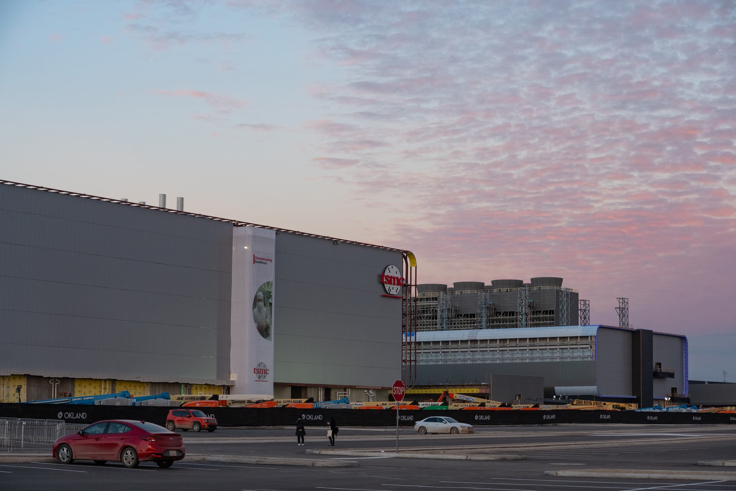 View of a factory at sunset.