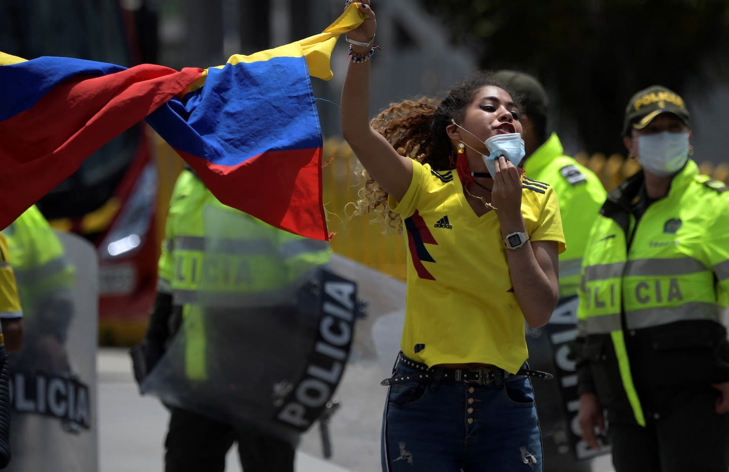 A protestor shouts slogans during a march to protest against the measures adopted by the Colombian government to fight the Covid-19 pandemic in Bogota on April 19, 2021. | Raul Arboleda/AFP via Getty Images