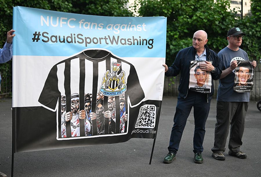 men holding a banner in protest 