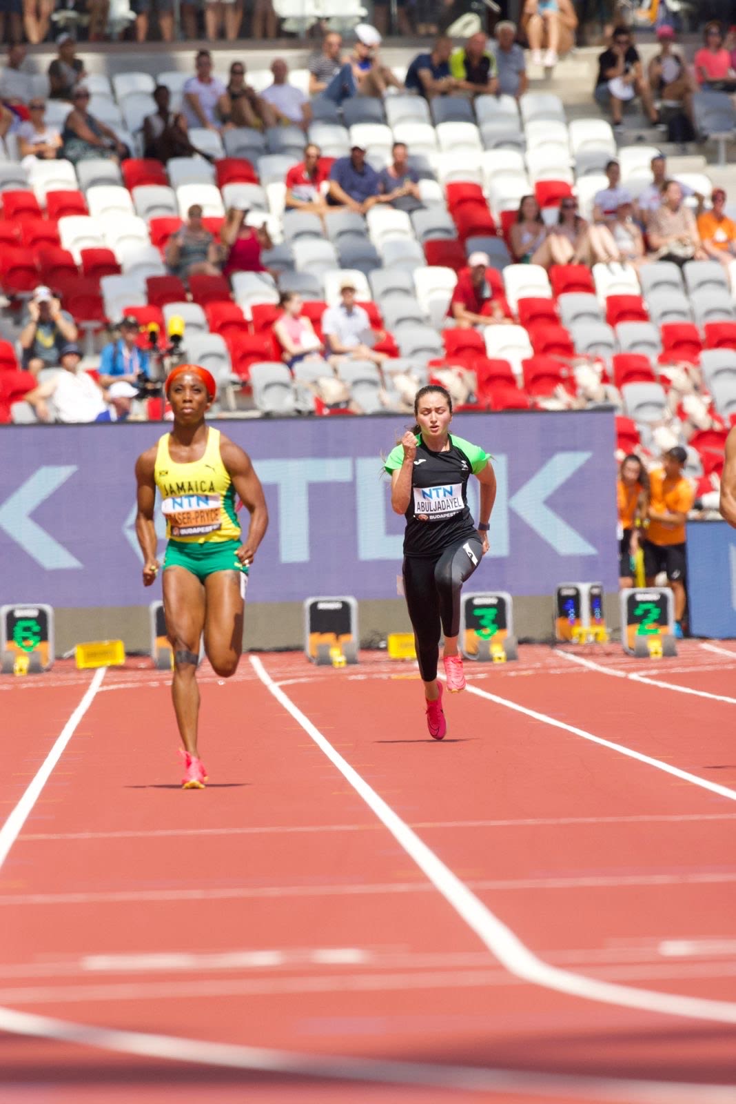 Yara Abuljadayel running in a stadium 