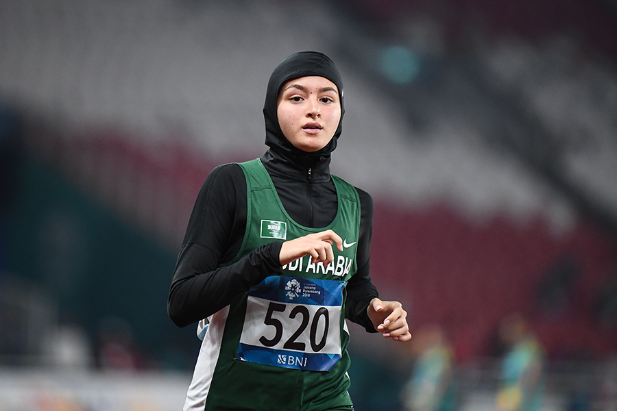 Yara Abuljadayel running in a stadium 