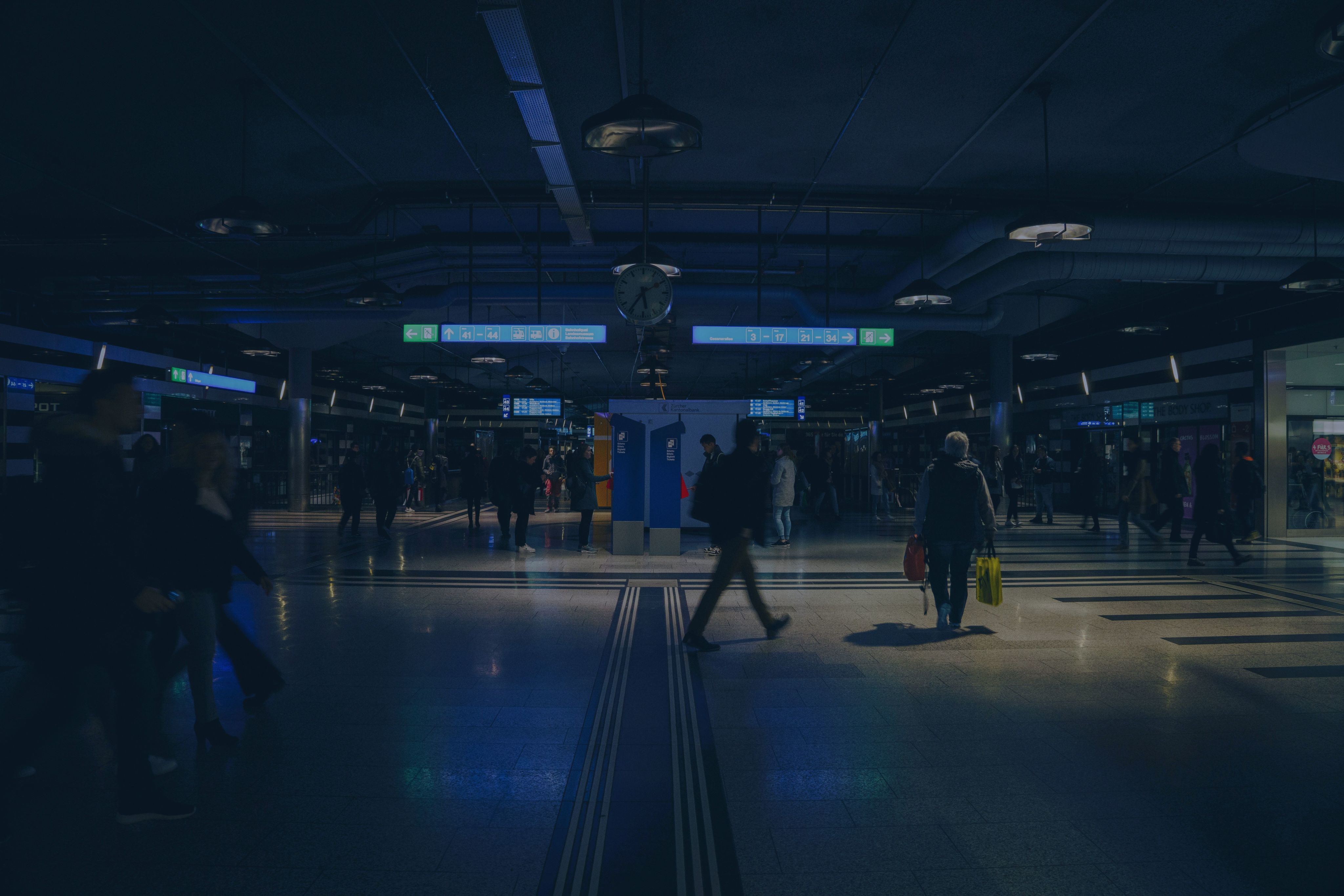 group of people walking inside building |Photo by Claudio Schwarz on Unsplash