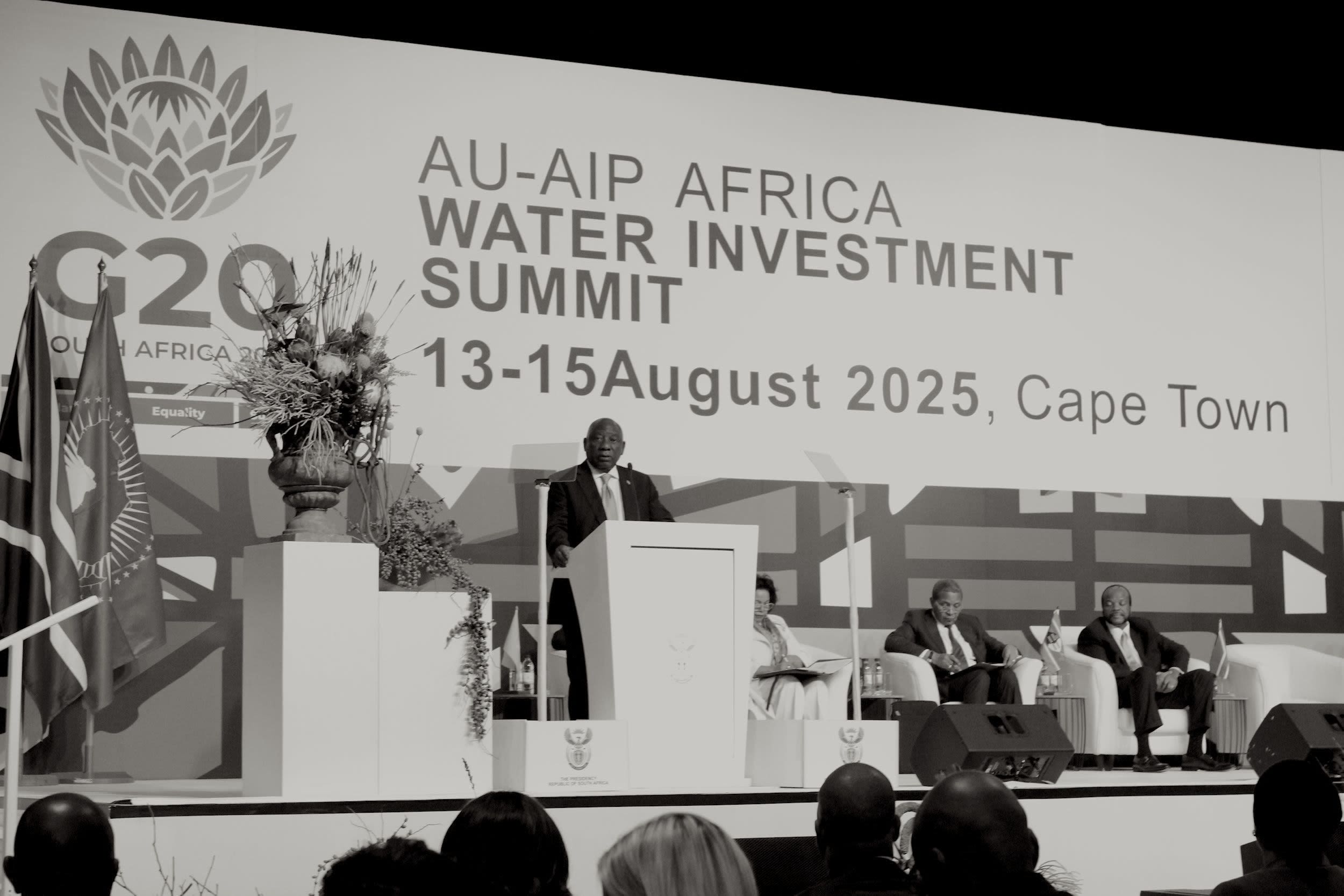 a foggy street with several buses parked on the side of the road
