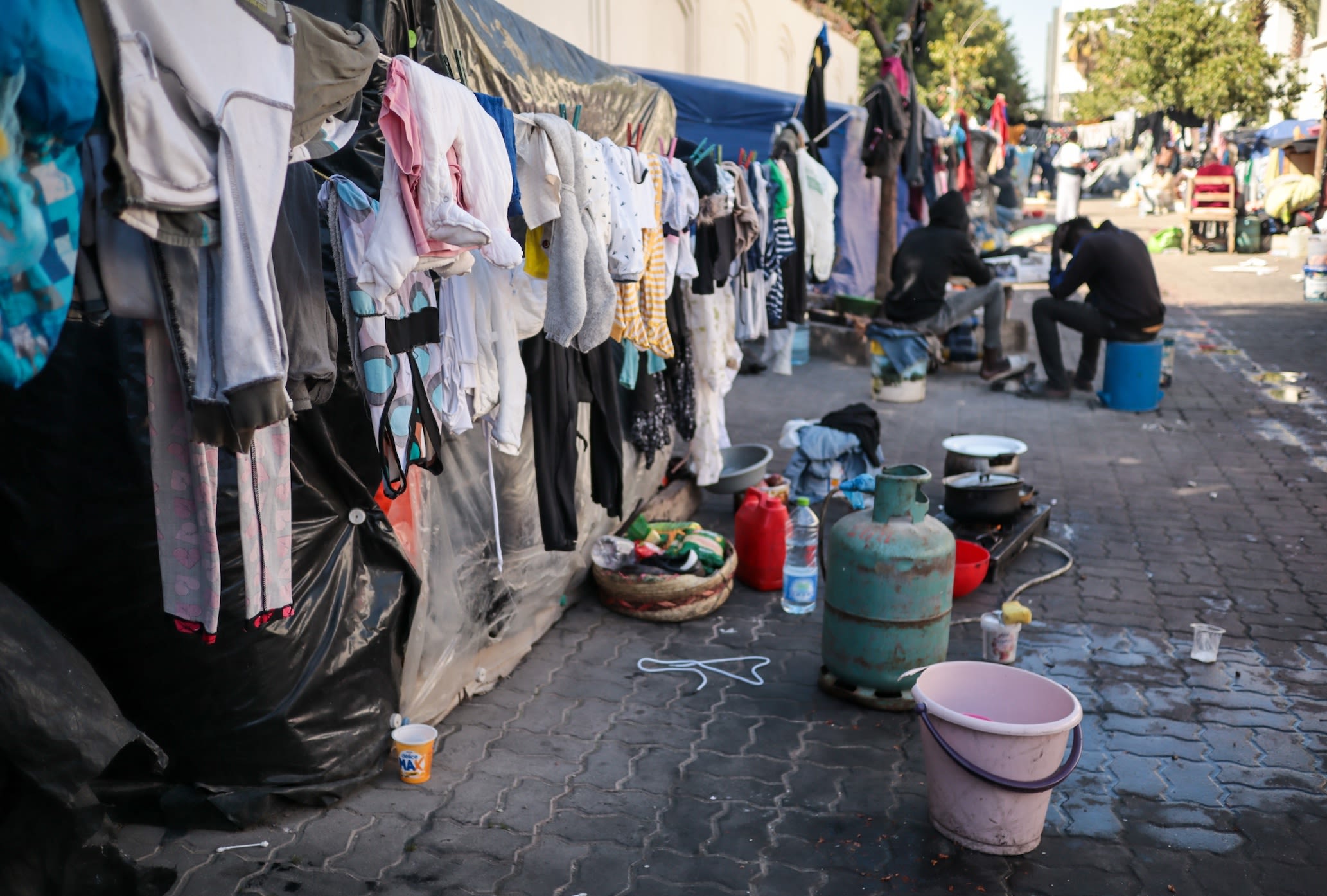 A view of a street in which African migrants live in tents in Tunis, 200 meters from the International Organization for Migration (IOM) building in Tunis in 2024. | Hasan Mrad/UCG/Universal Images Group via Getty Images