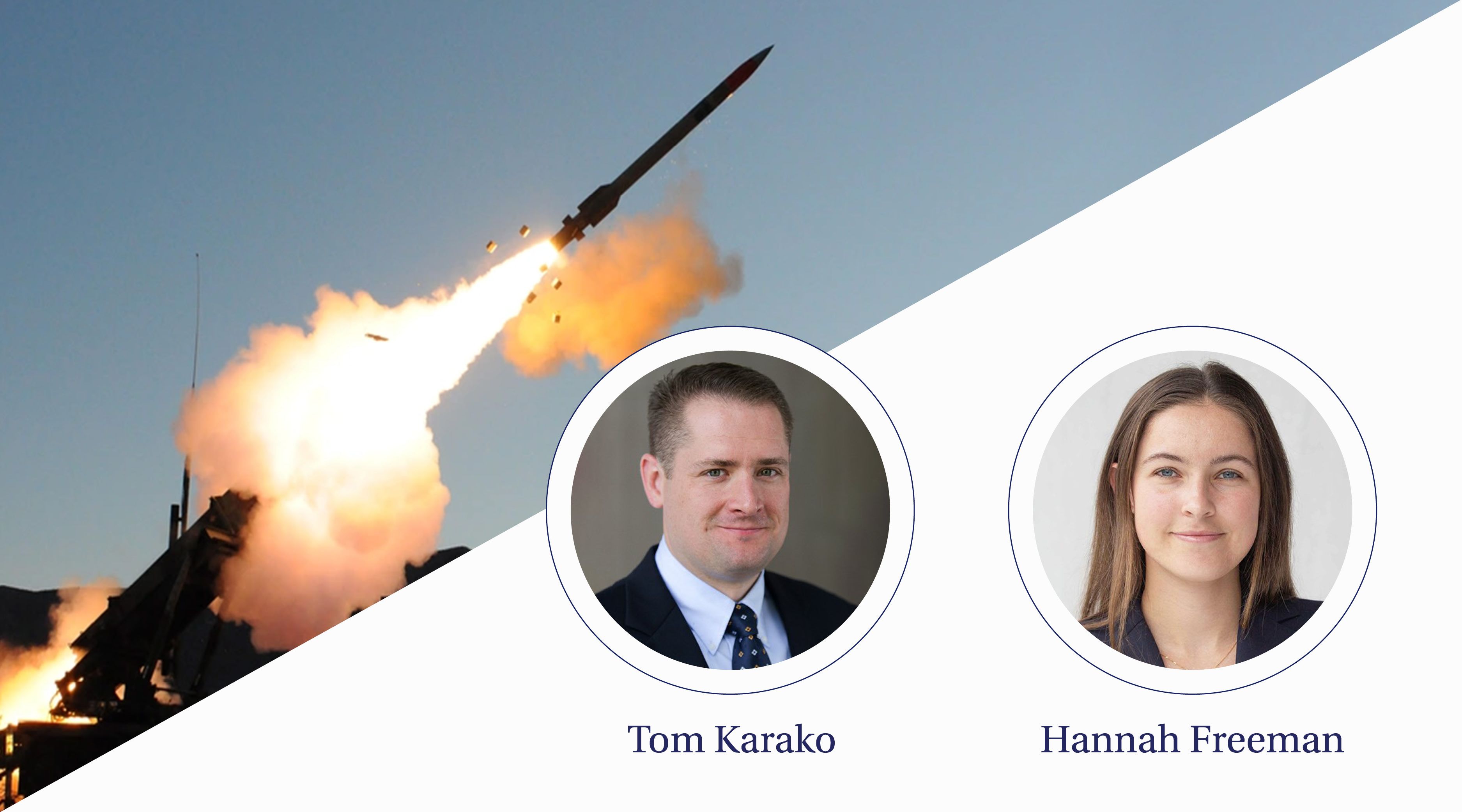 A narrow shaped missile is launched in a cloud of orange fumes from the ground.